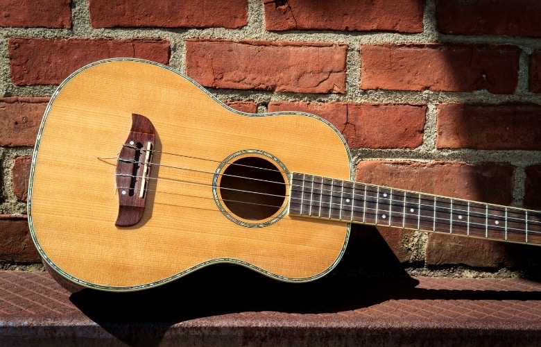 Baritone Ukulele in a brick background