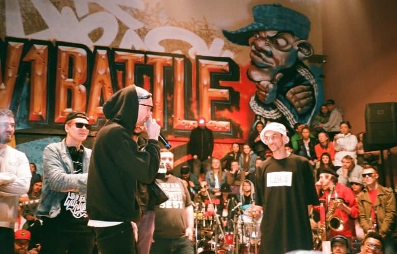Rappers gathered in a closed room to battle. 