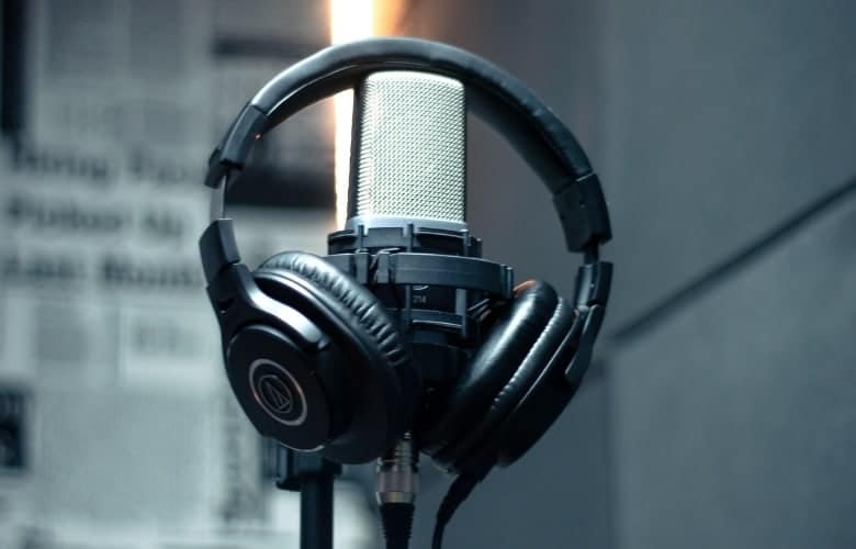 Microphone and headphones in a music studio