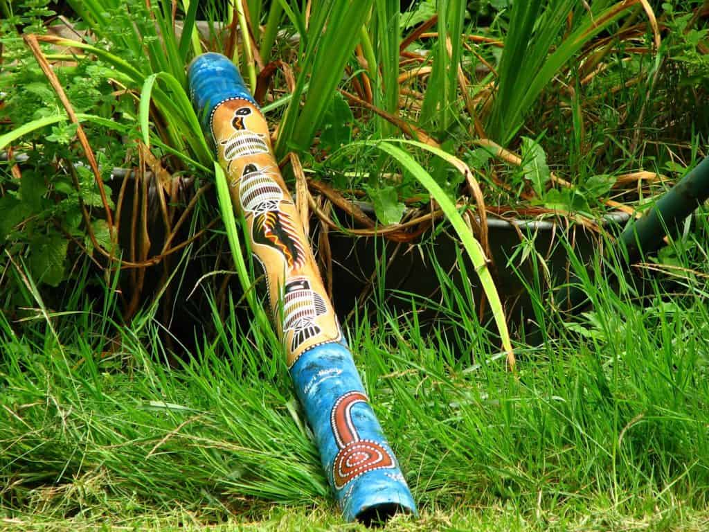 A colorful Didgeridoo on the grass