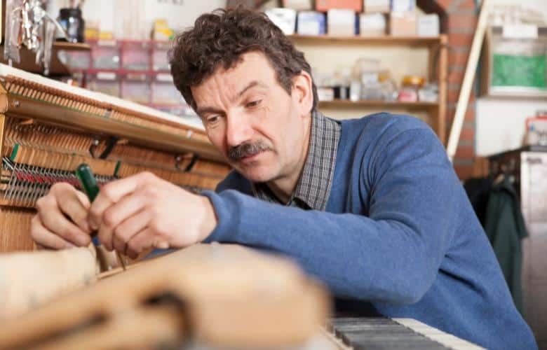 A piano tuner at work