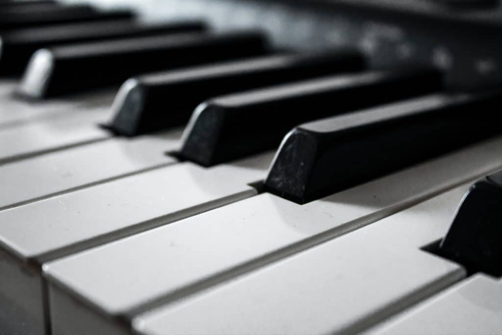 grayscale photography of piano