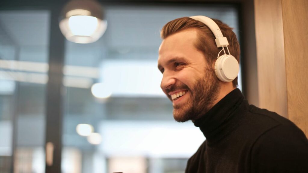 A man wearing a pair of on-ear headphones